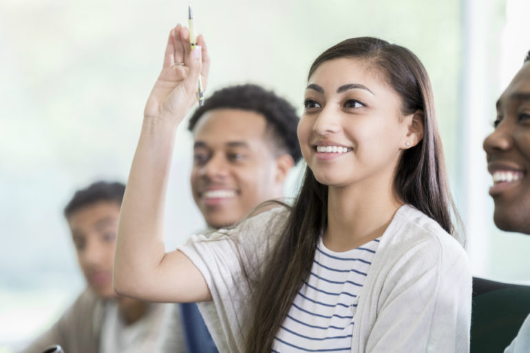 Women raising hand for question, what to know about counseling psychology blog