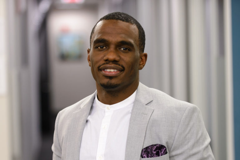Rwenshaun Miller in a gray suit