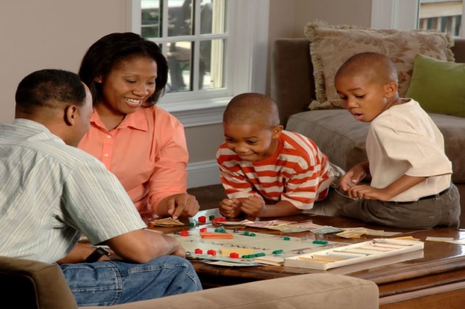 family playing board game at home