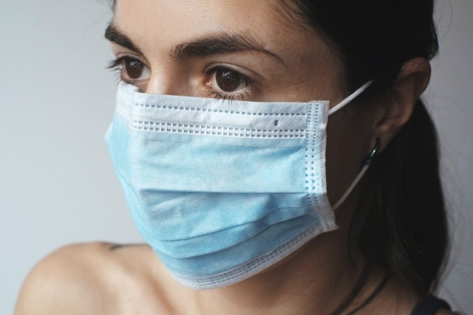 woman wearing a surgical mask
