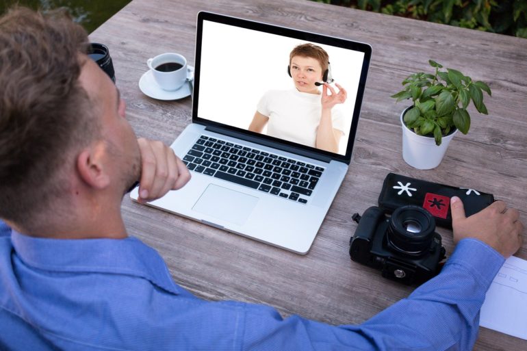 man looking at laptop