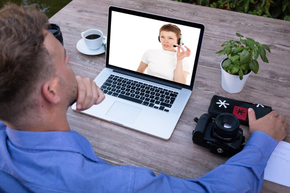 man looking at laptop