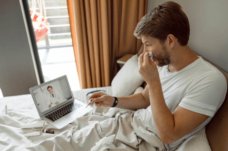 Man in bed with cold
