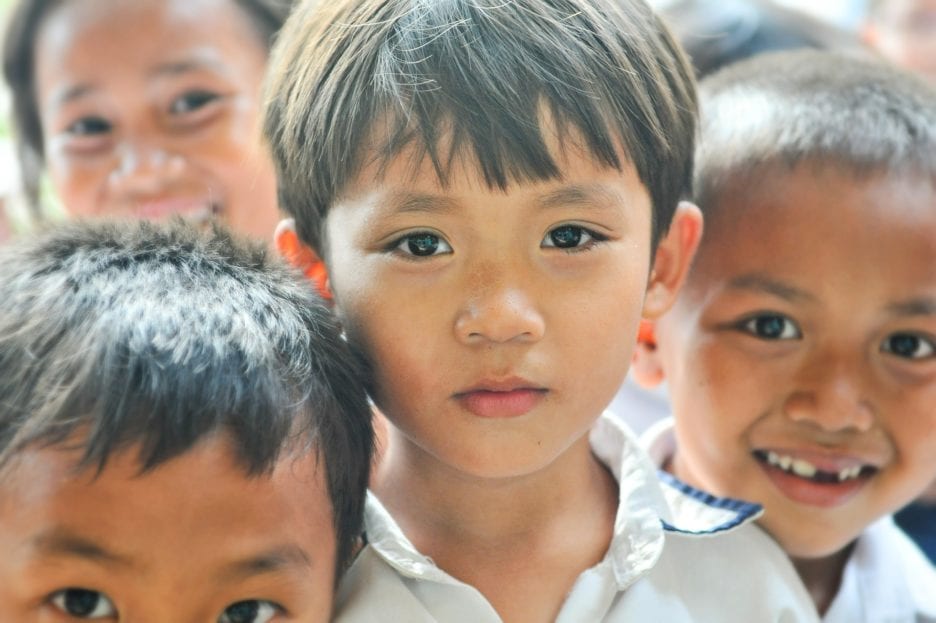 young boy with neutral expression on his face