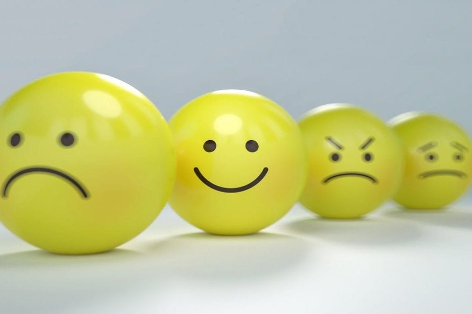 faces on yellow balls