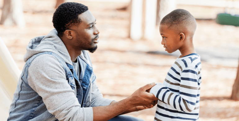 father talking to his son