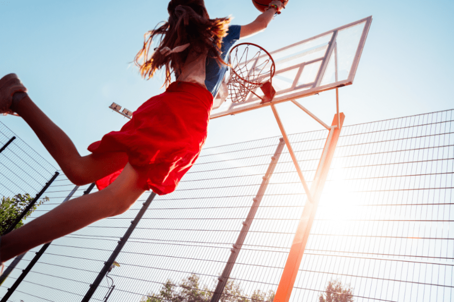 young girl playing basketball