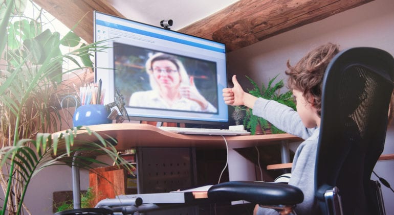 student engaging with school counselor online
