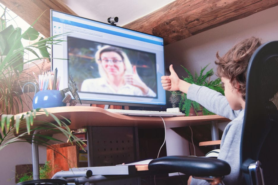 student engaging with school counselor online
