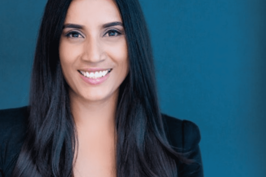 woman with dark hair smiling