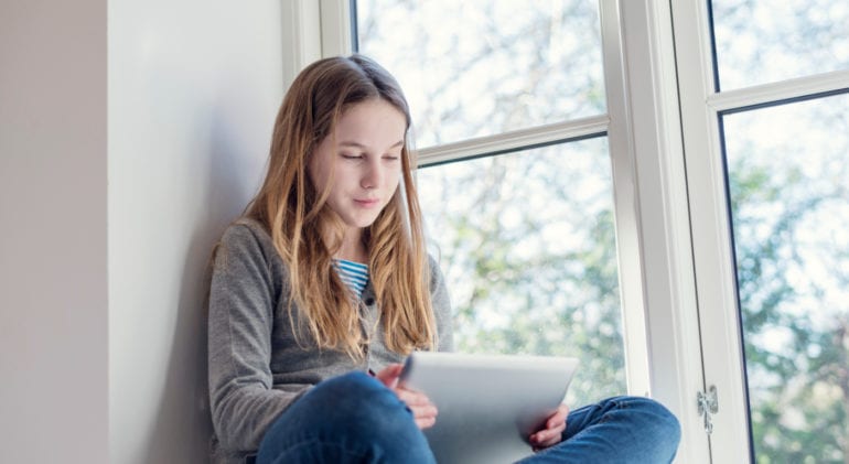 teenager with tablet