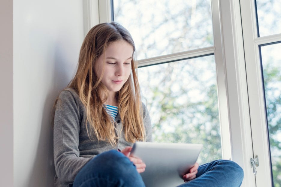 teenager with tablet