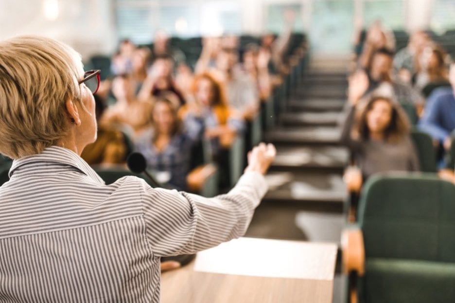 Woman teaching college class, counselor education and supervision