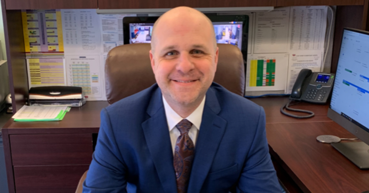 Damon Englese at desk
