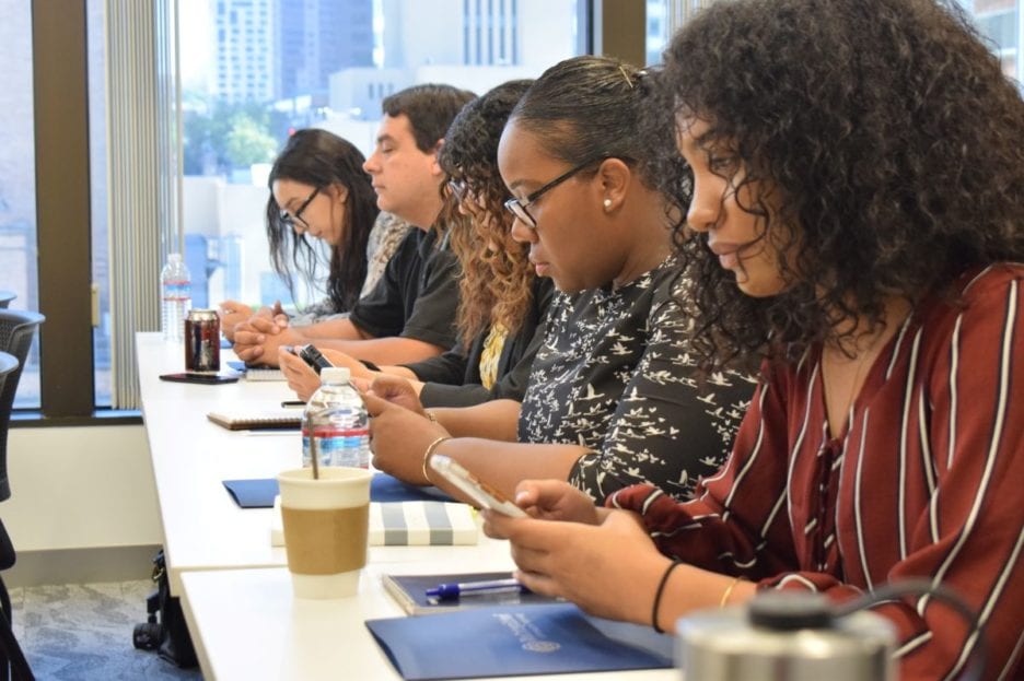 Students sitting at a long table