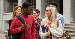 male and female students walking and talking