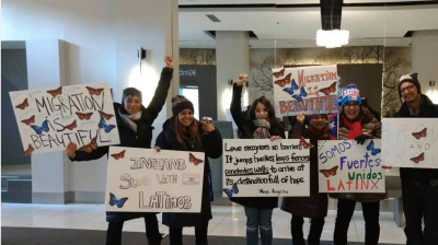 Group of people standing with posters