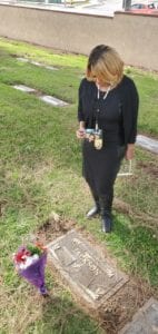 Clarice Kavanaugh standing at a grave