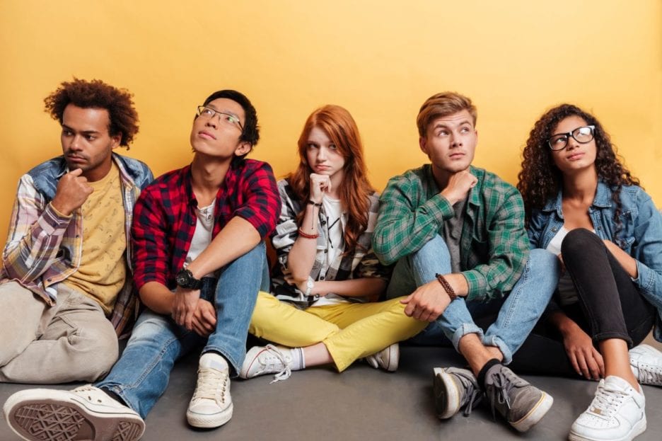 people sitting on the floor looking around
