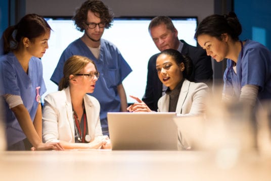 health care administrator with hospital staff