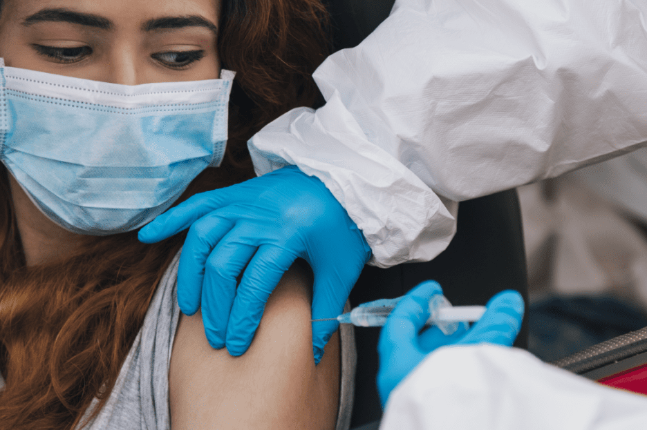 Person getting covid vaccine shot