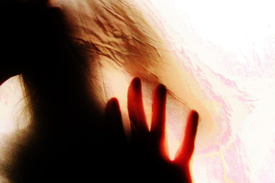 silhouette of person and hand