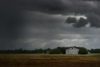 field under stormy skies