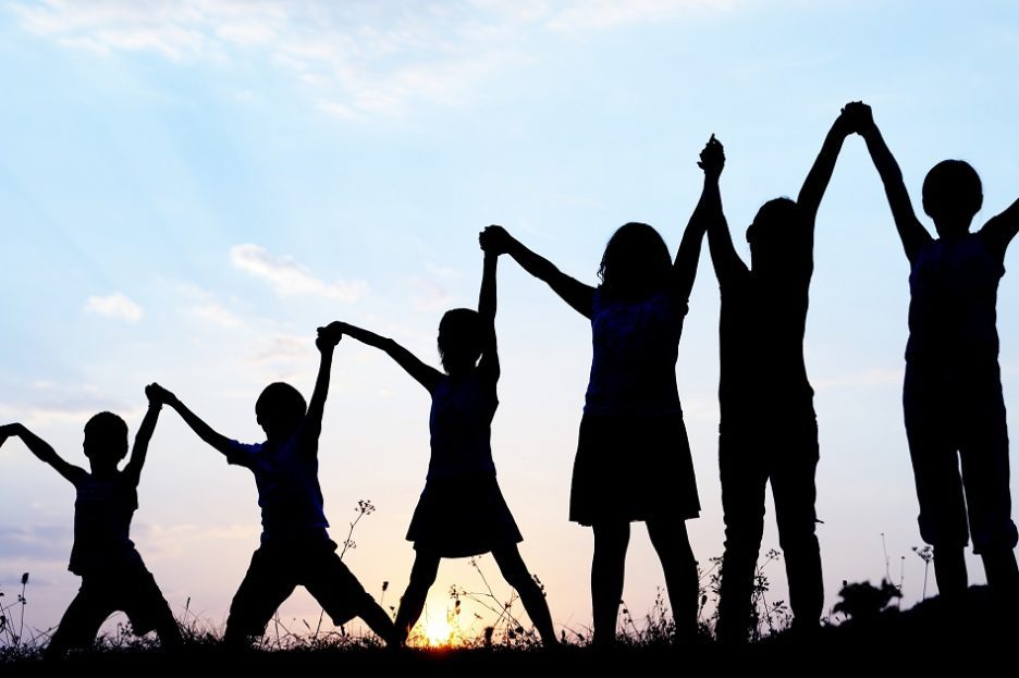 Group of people with raised hands